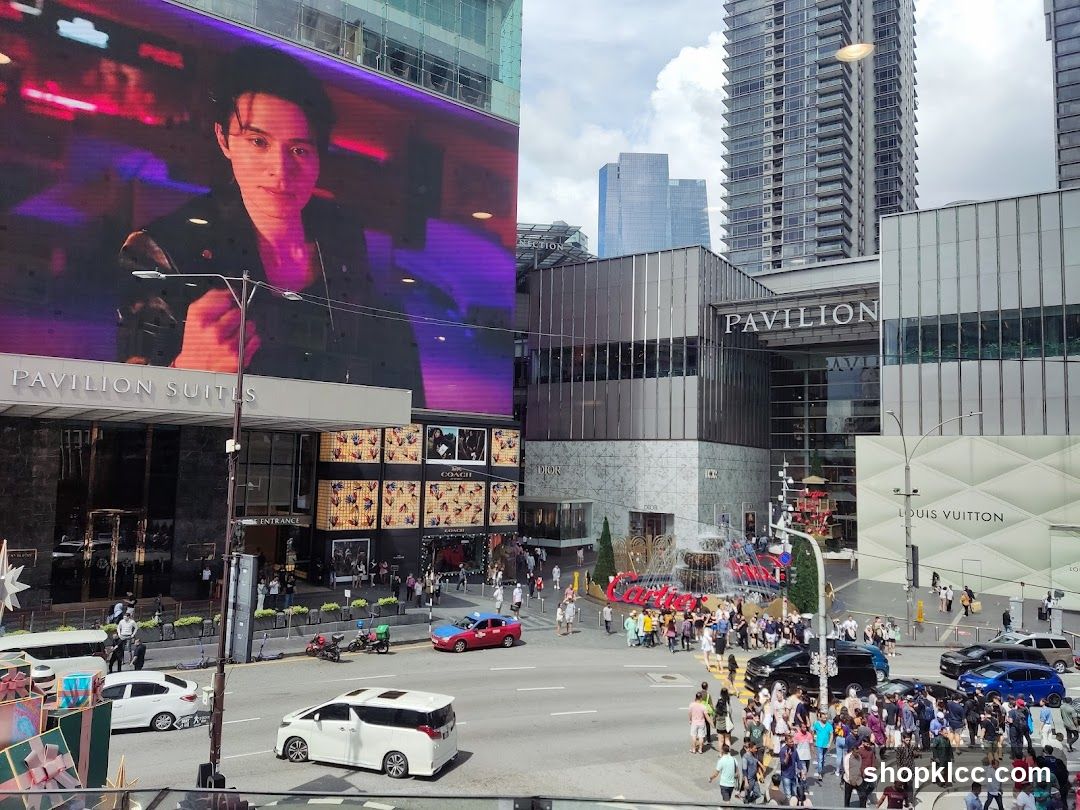 Busy City Street with Large Digital Billboard and Shopping Center