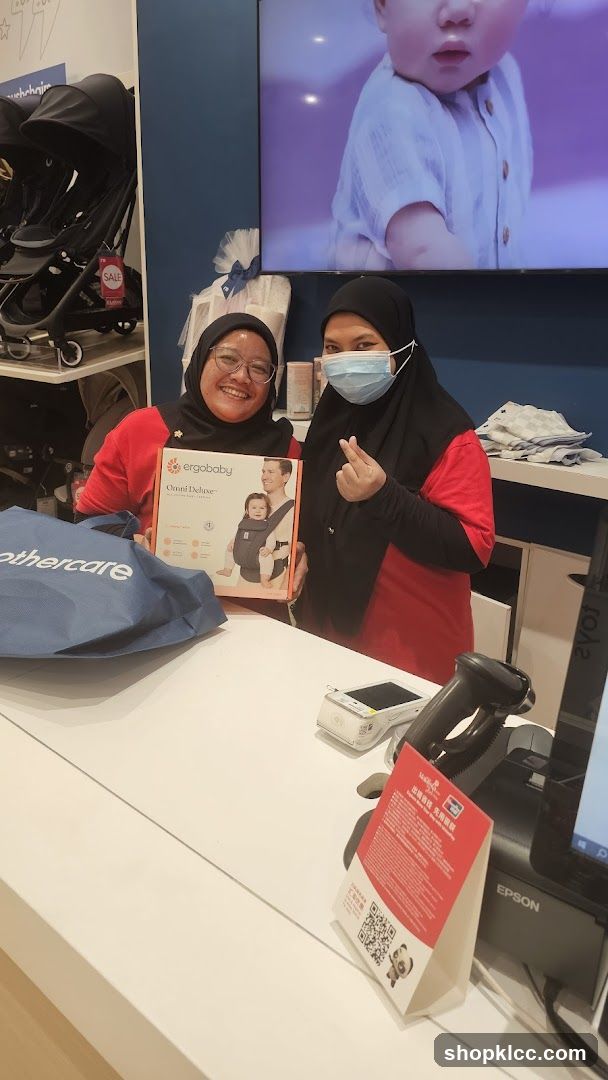Store Employees with Baby Carrier