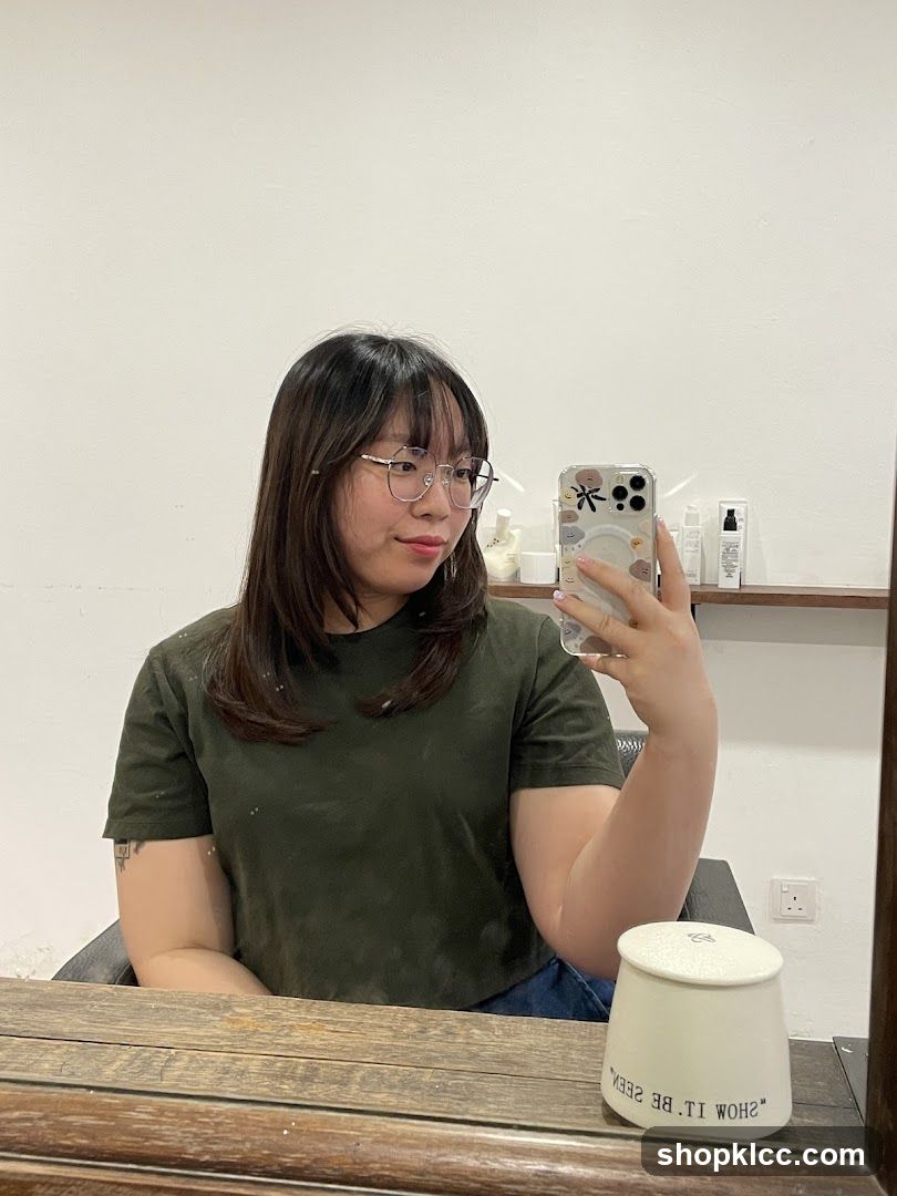 Woman taking a mirror selfie