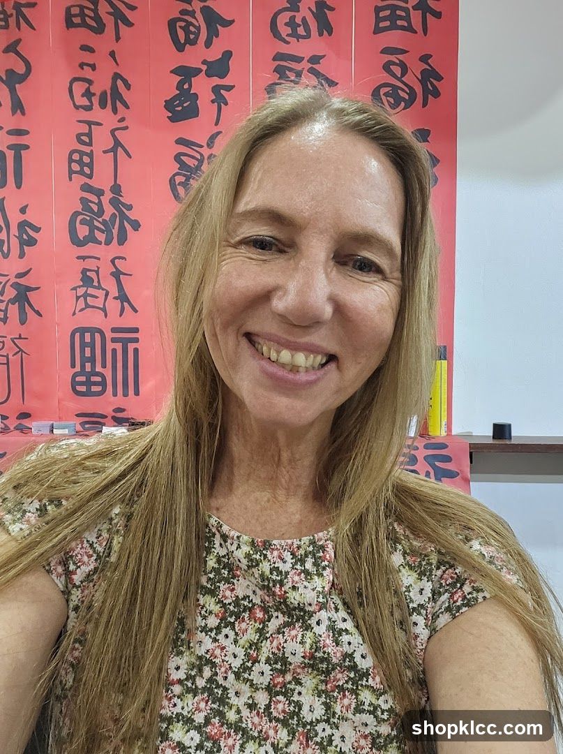 Woman in front of calligraphy