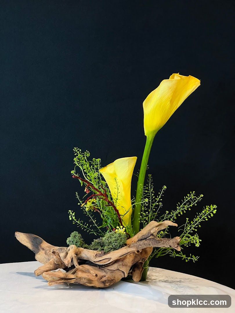 Floral Arrangement with Yellow Calla Lilies and Driftwood