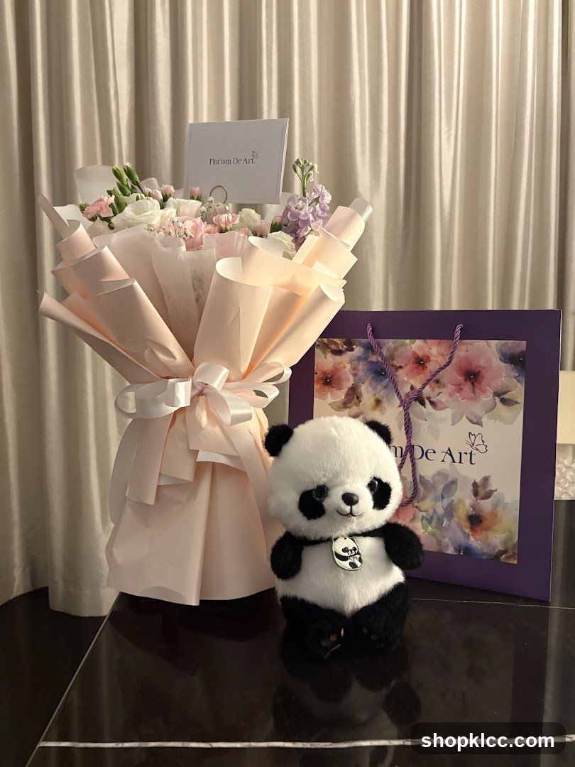 Floral arrangement with panda toy
