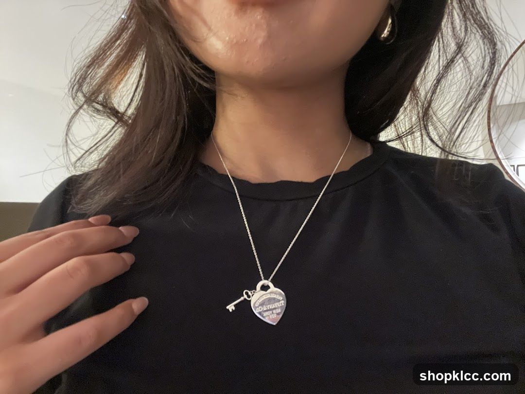 Heart-shaped pendant necklace on black shirt