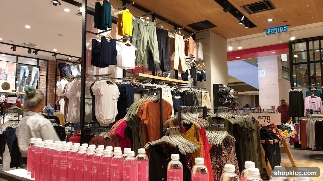 Clothing Store Interior with Pink Bottles in Foreground