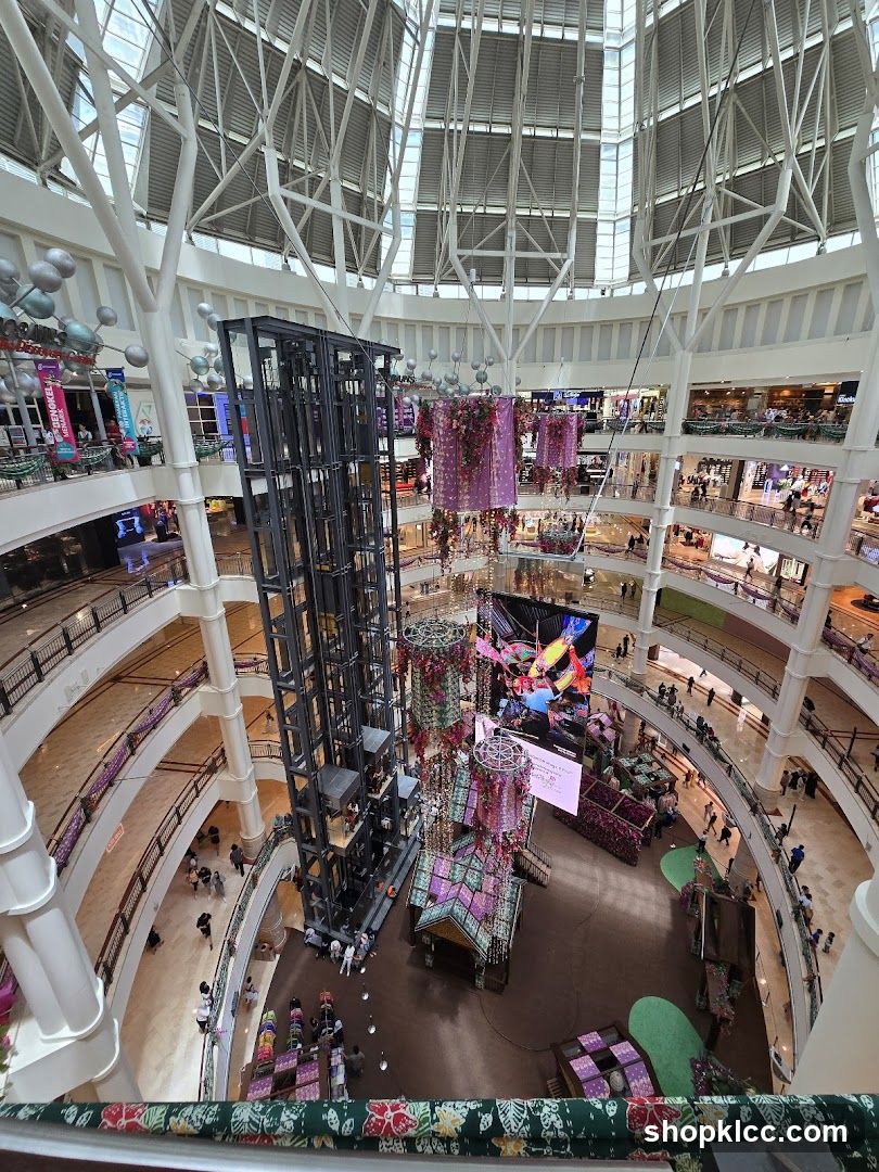 Interior of a multi-level shopping mall with a central atrium