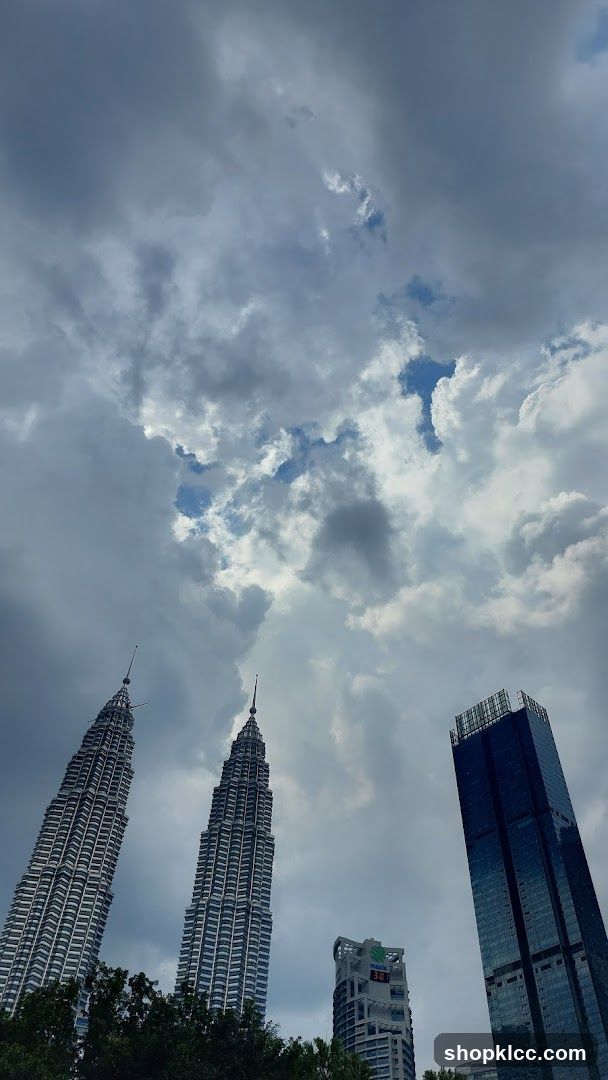 Petronas Towers under cloudy sky