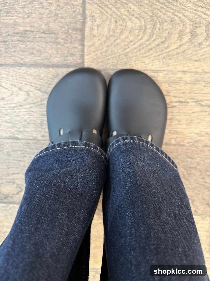 Feet in Dark Shoes and Jeans