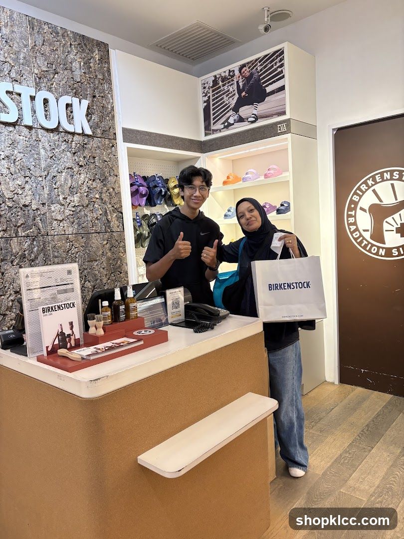 Two people at a Birkenstock store counter