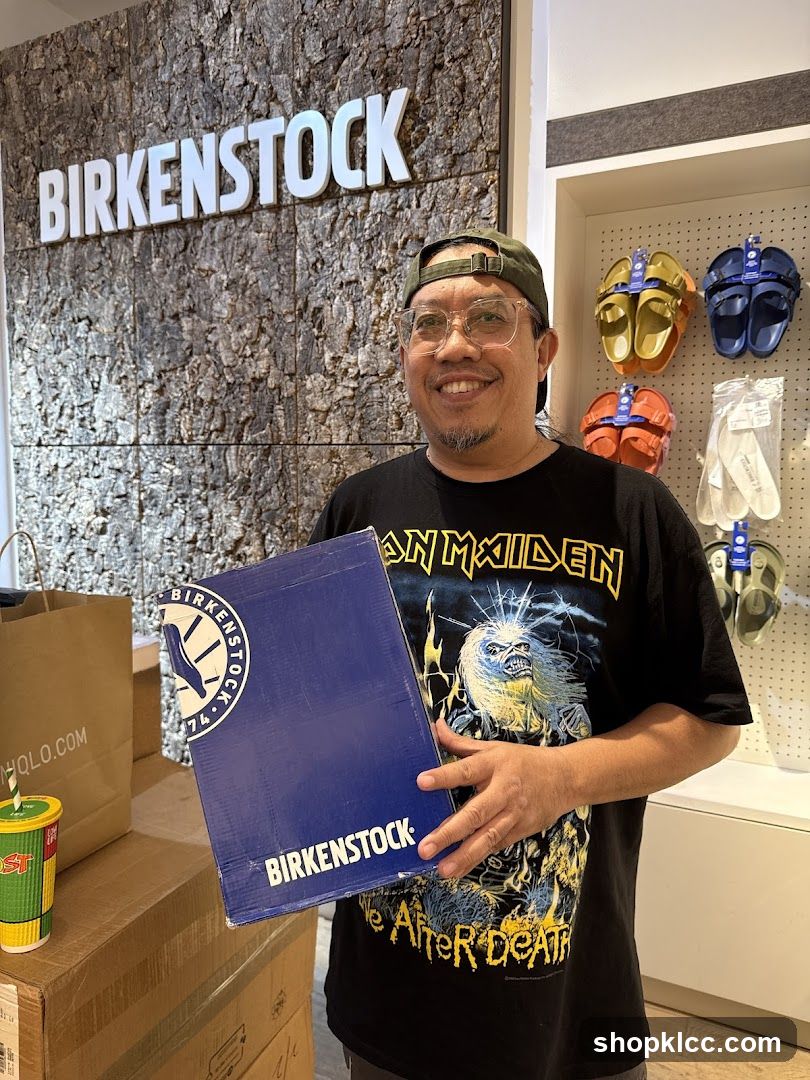 Man holding a Birkenstock box