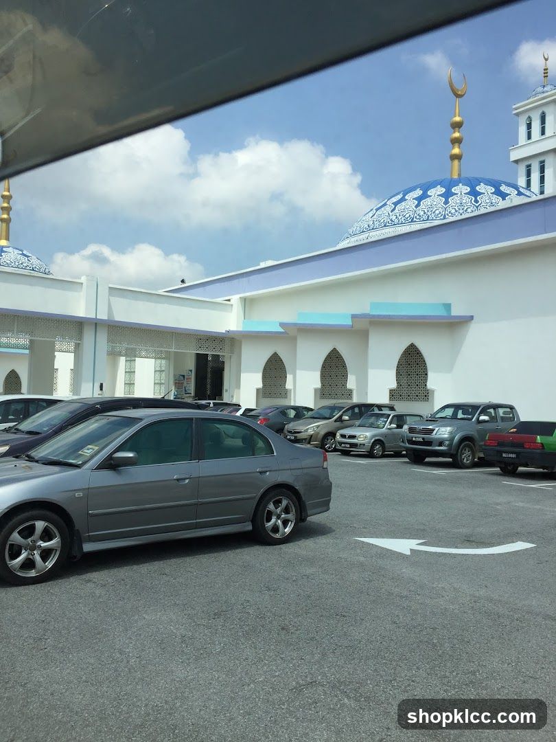 Mosque with Cars in Parking Lot