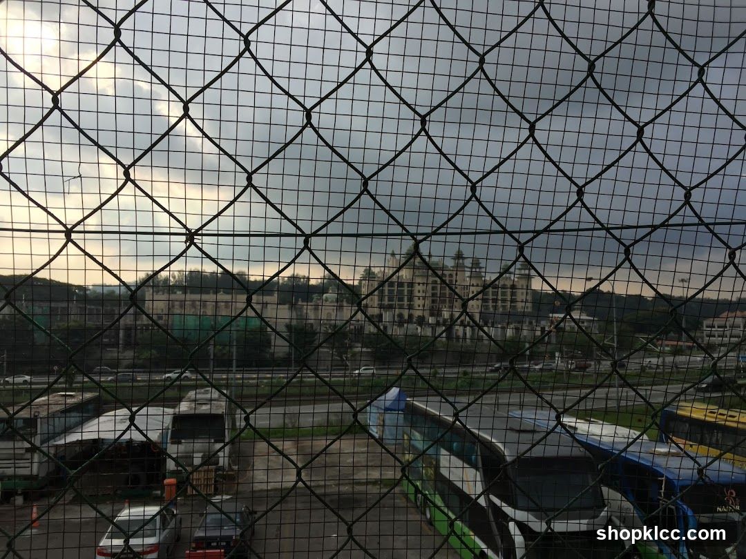 Buses parked near a large building