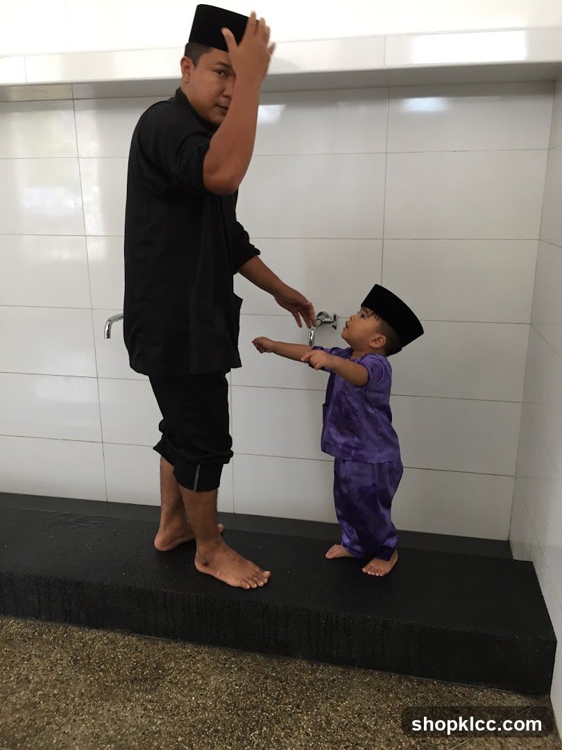 Man and child preparing for prayer
