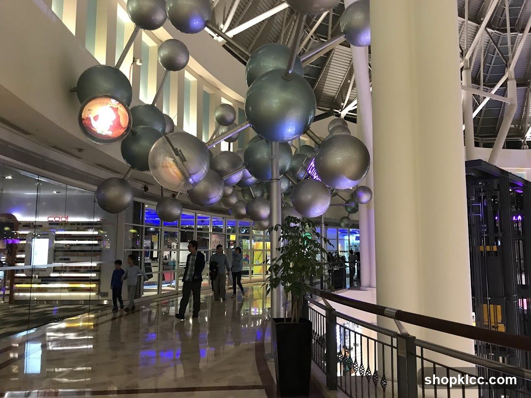Interior of a shopping mall with a large molecular sculpture