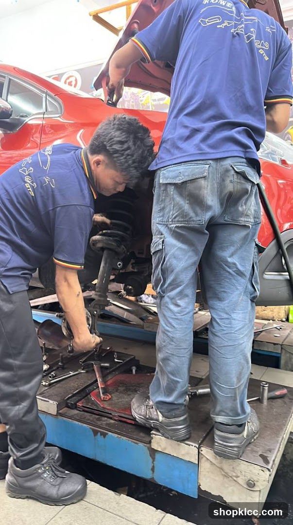Mechanic Working on Car Lift