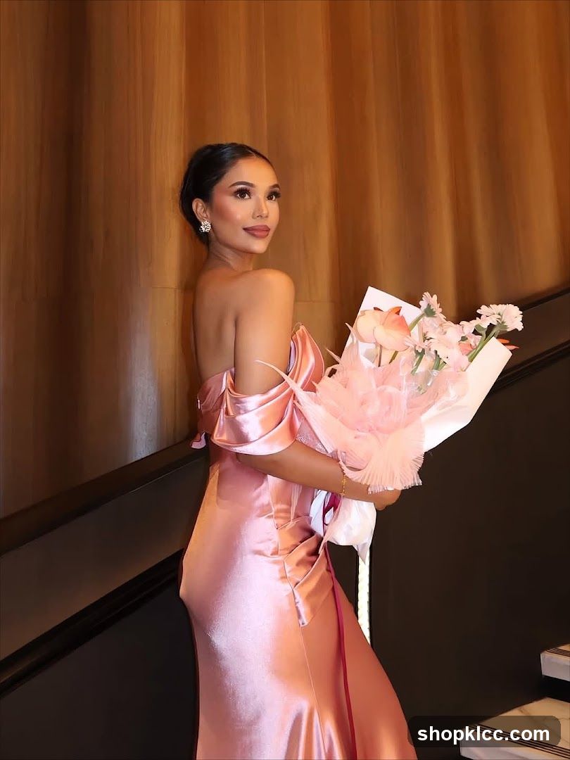 Woman in Pink Dress Holding Flowers