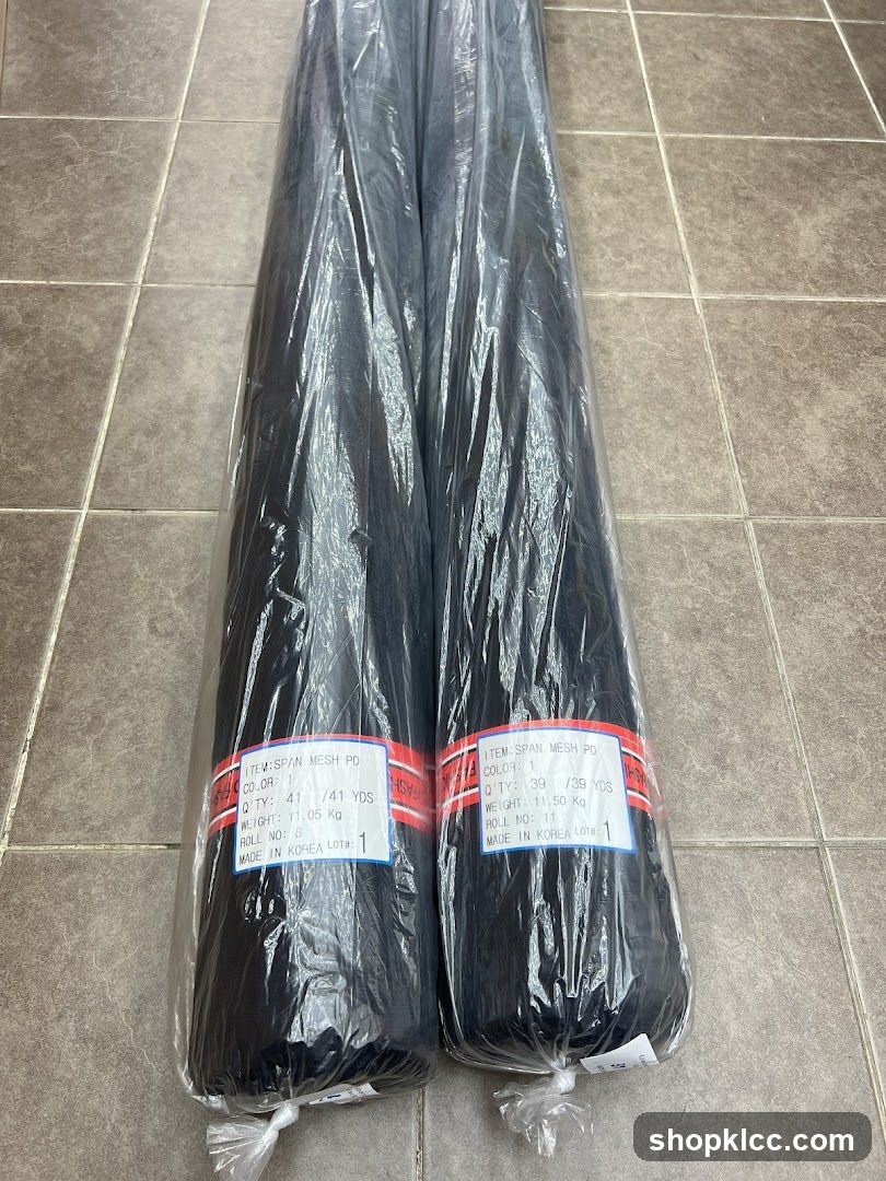 Two Rolls of Black Mesh Fabric