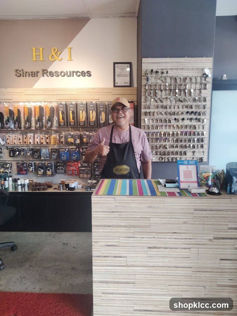 Man giving a thumbs up in a shop