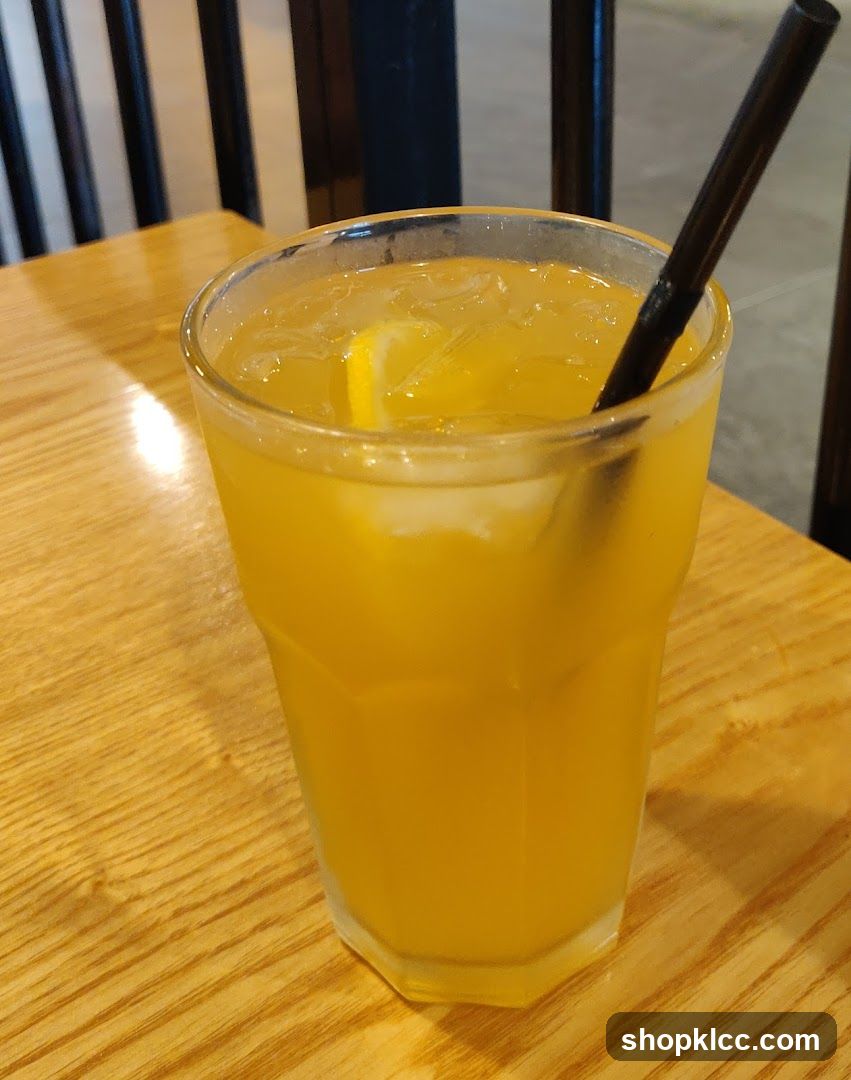 Orange Juice with Lemon and Straw