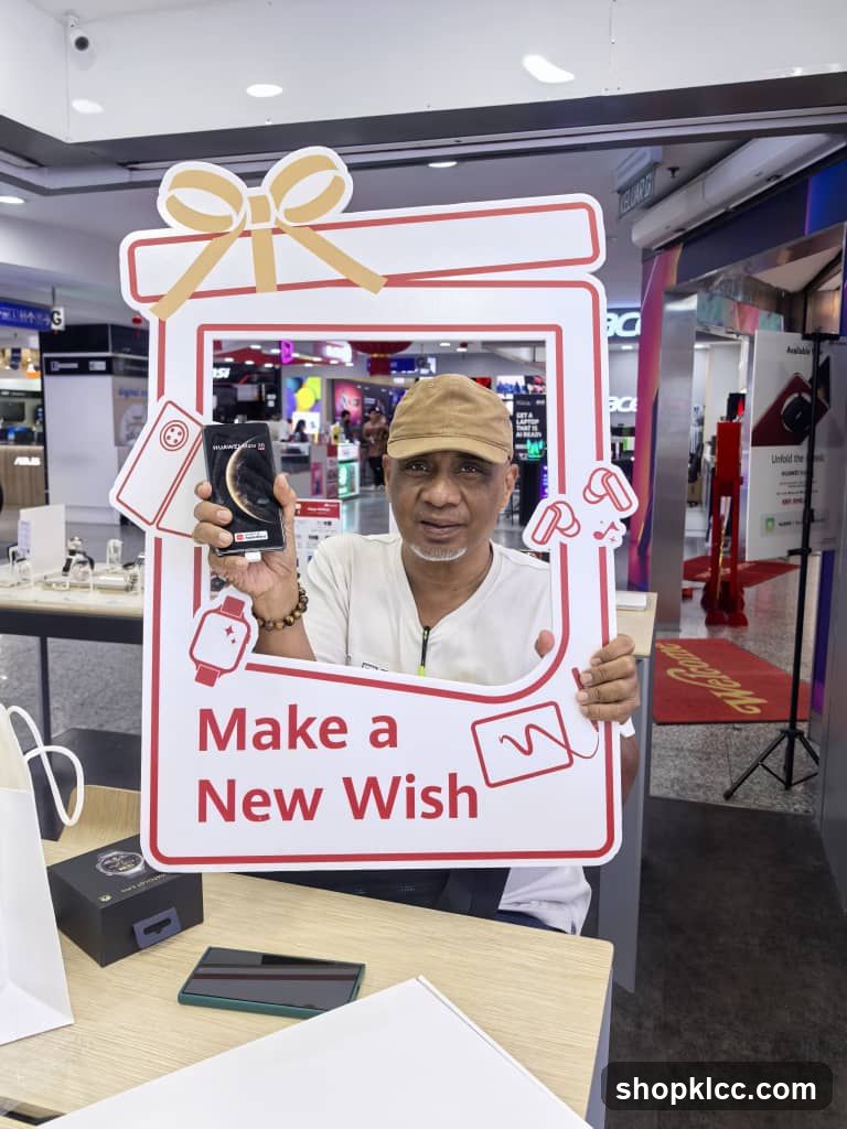 Man holding a phone in a gift-shaped frame