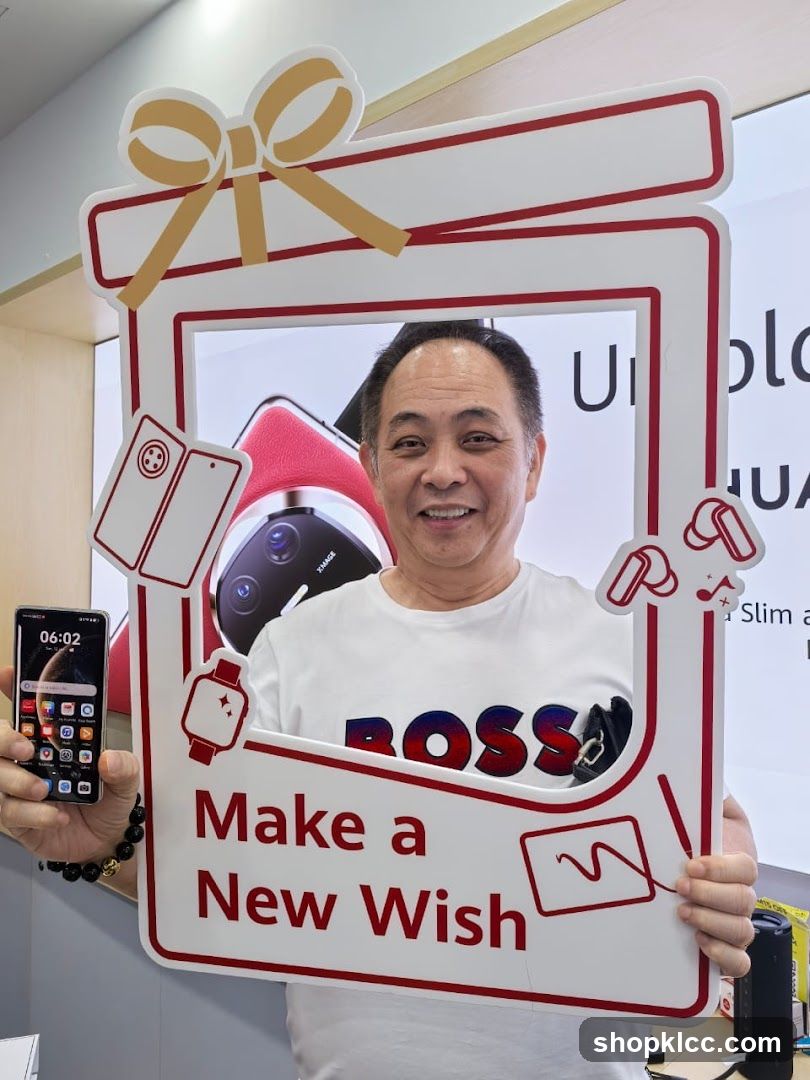 Man holding a promotional frame
