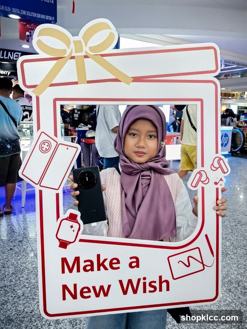 Girl Holding a "Make a New Wish" Photo Frame