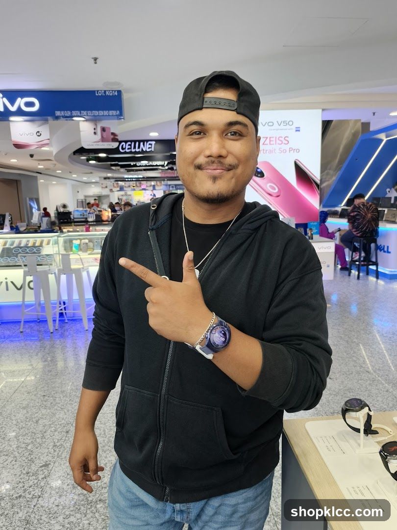 Man pointing in electronics store