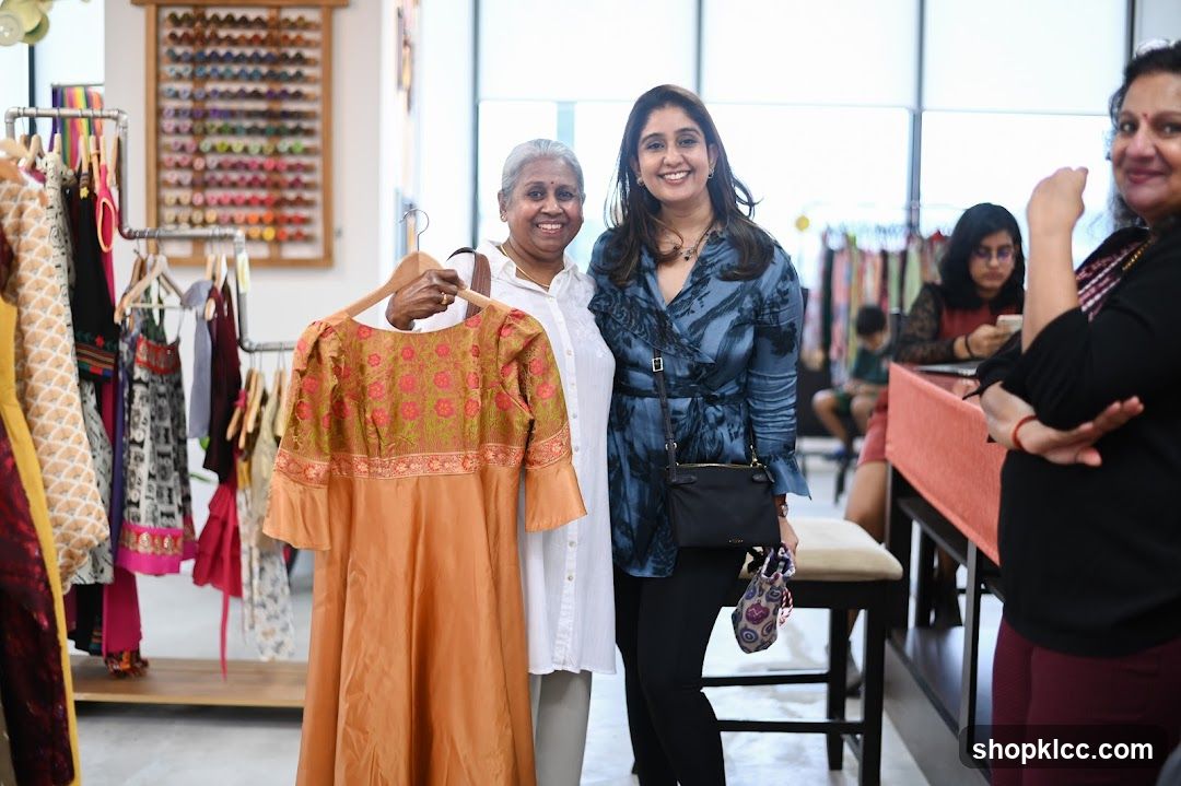 Women admiring clothing in a store