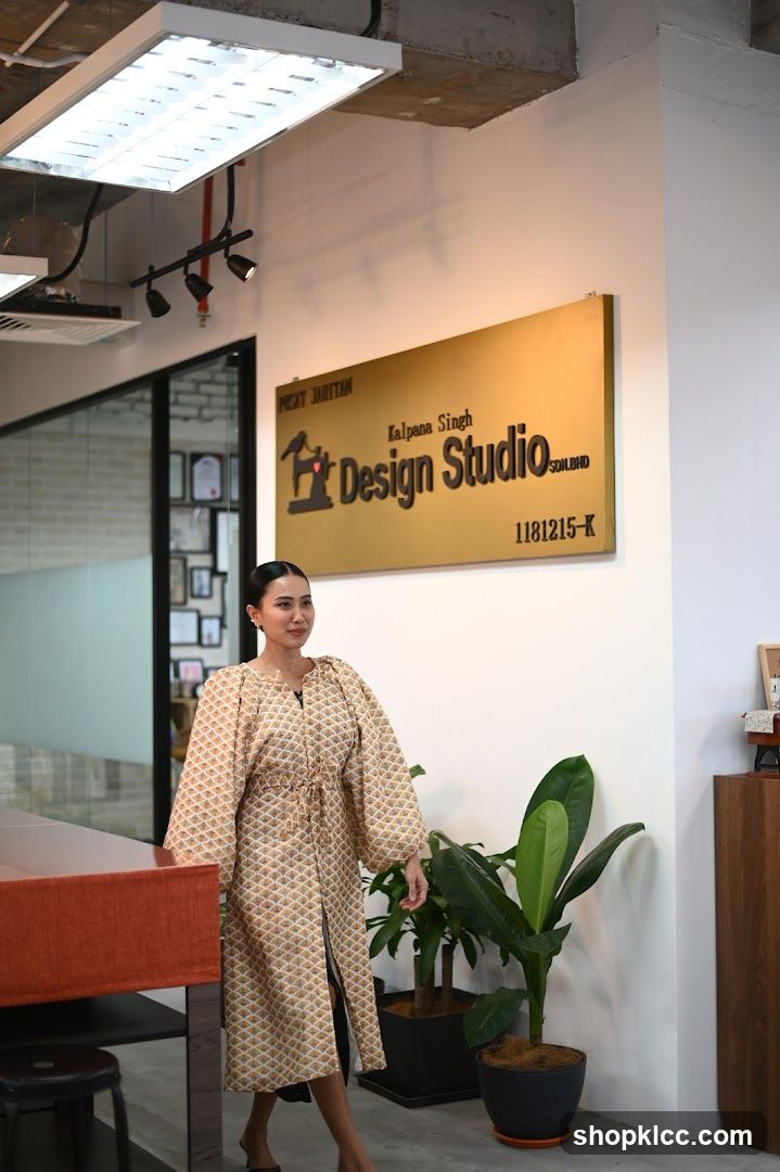 Woman in a patterned dress in an office space