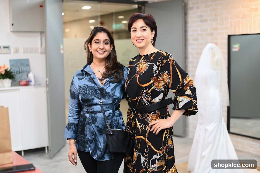 Two Women Posing in a Bridal Shop
