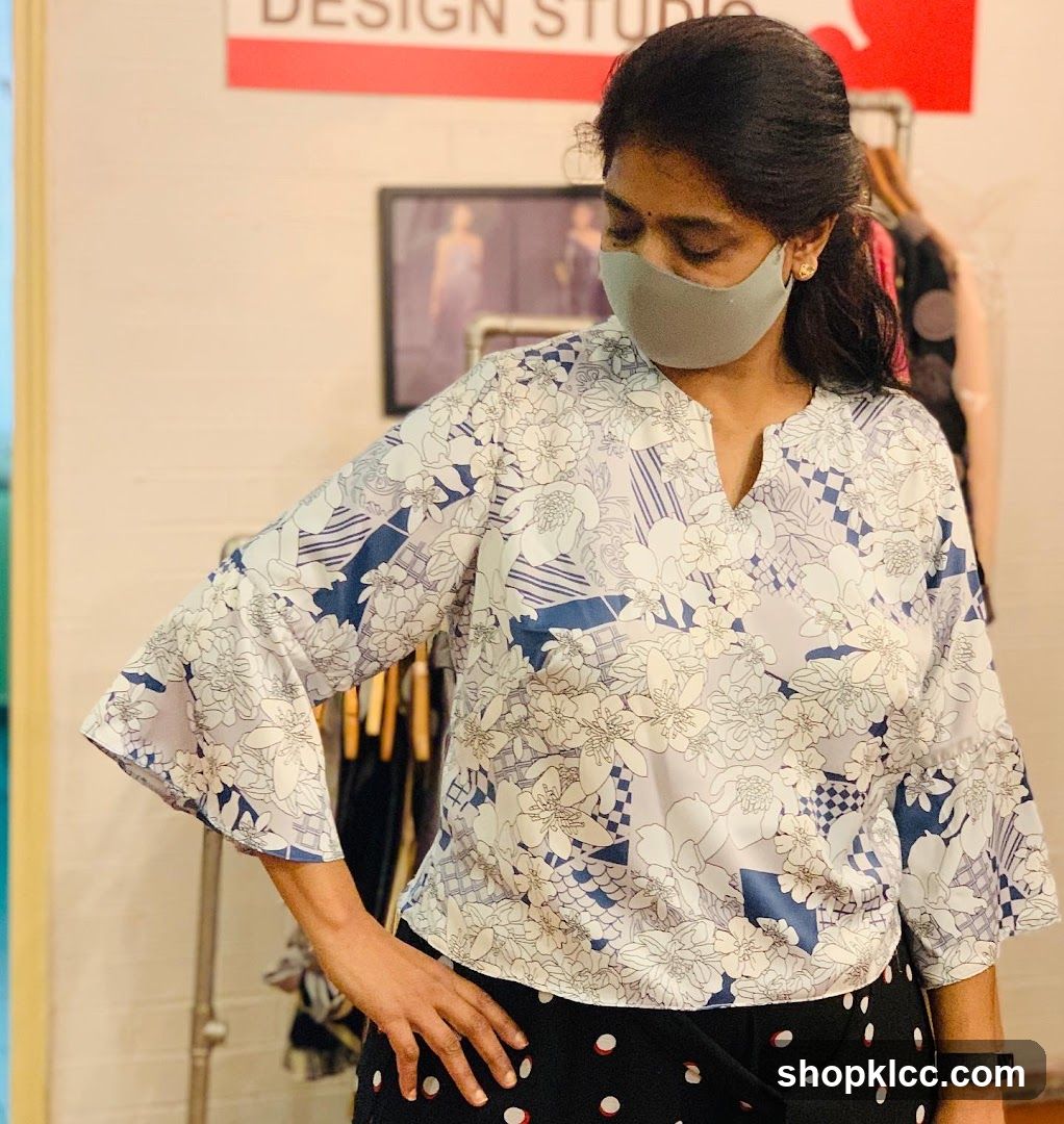 Woman in patterned blouse
