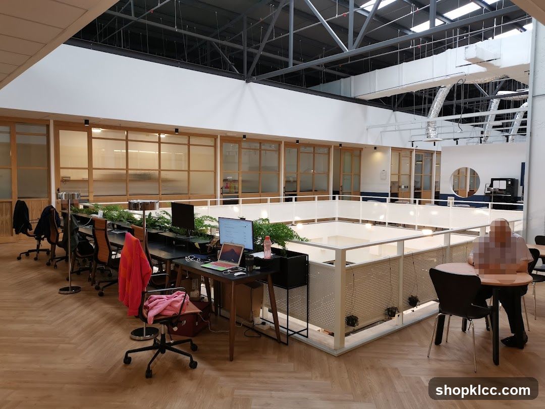 Modern Office Space with Desks and Seating Areas