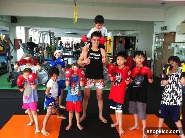 Children in boxing gloves at a gym