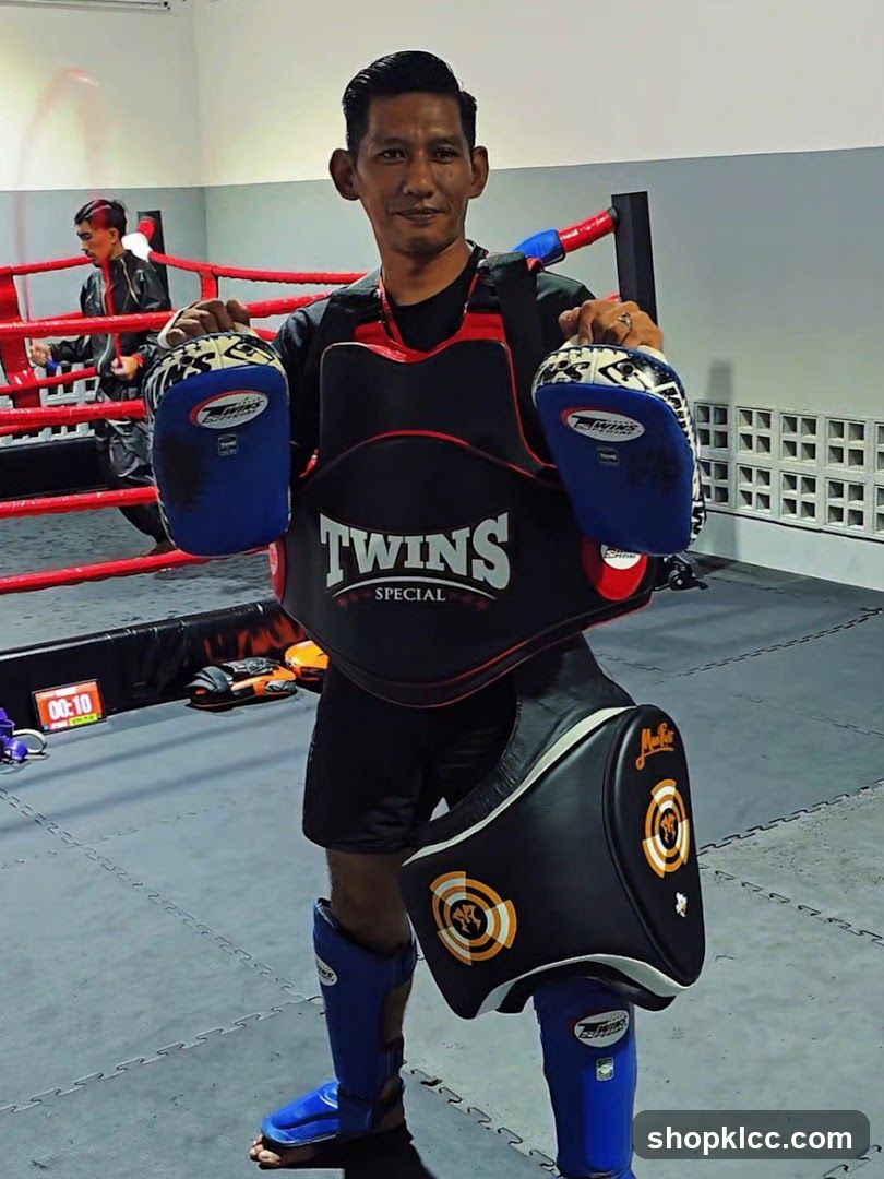Muay Thai Trainer with Gear