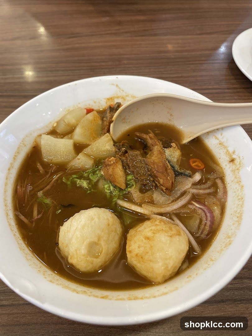 Bowl of Soup with Meatballs and Vegetables