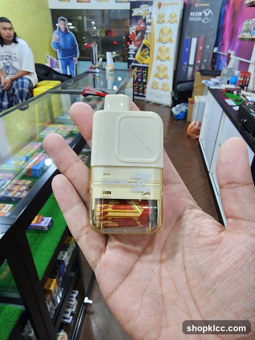 Hand holding vape device in store