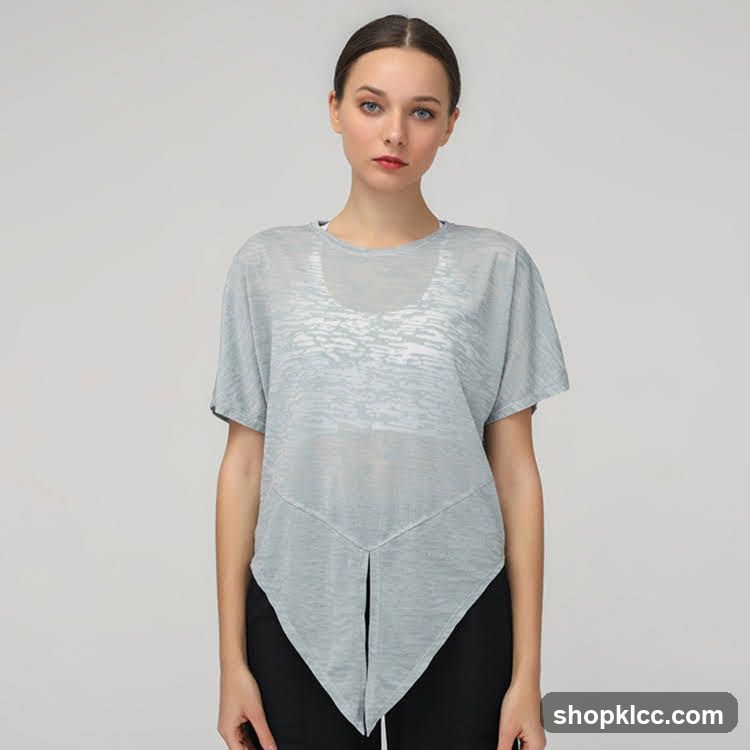 Woman wearing a light blue sheer top with asymmetrical hemline