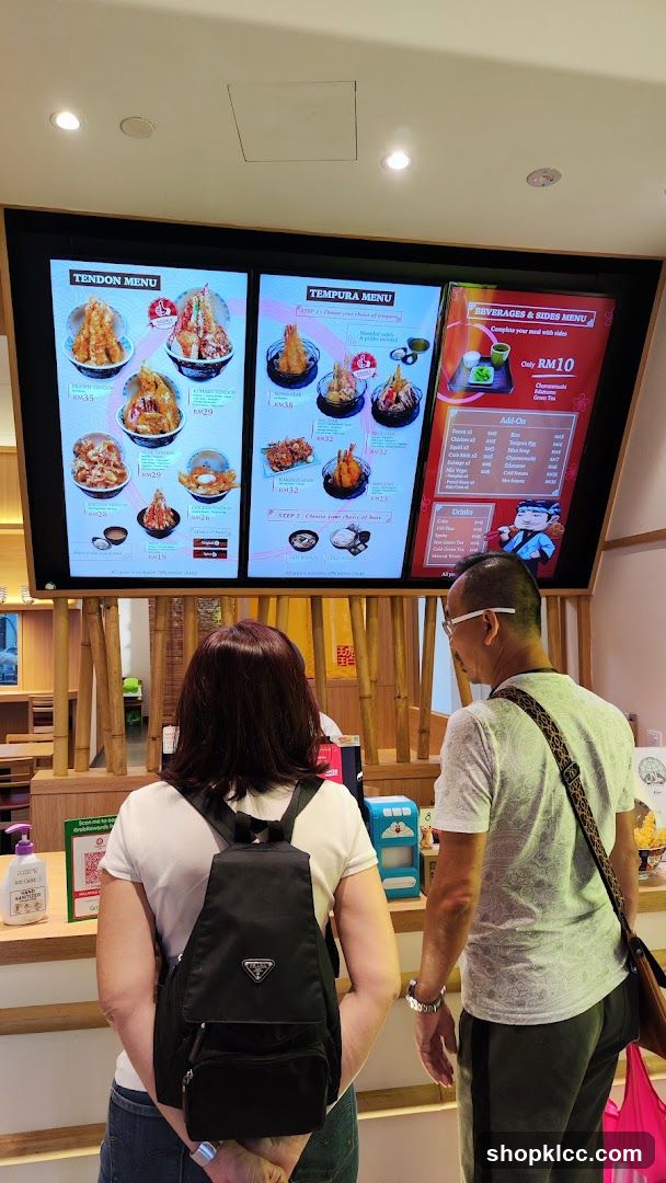 Customers Viewing Menu Board