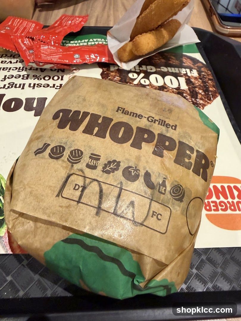 Burger in Wrapper with Condiments