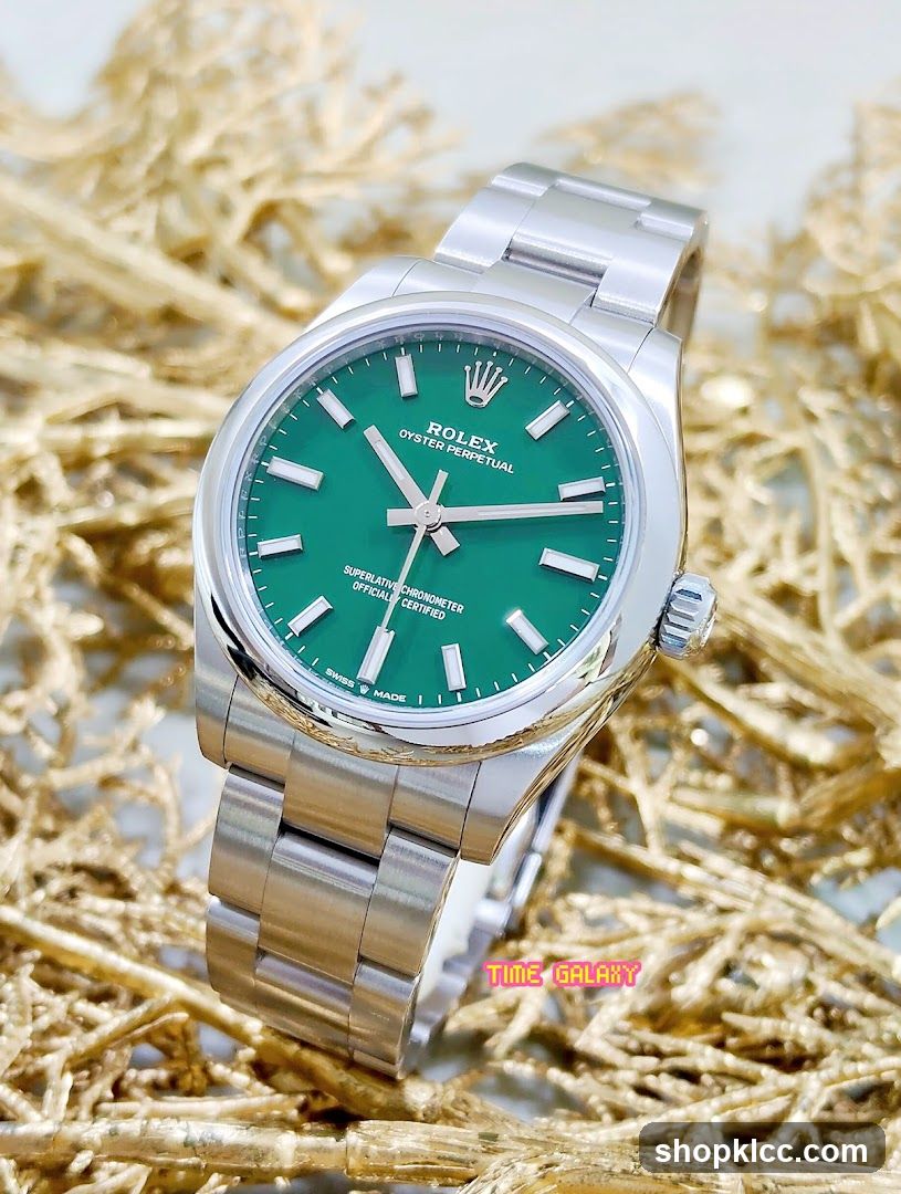 Rolex Oyster Perpetual Date Watch with Green Dial
