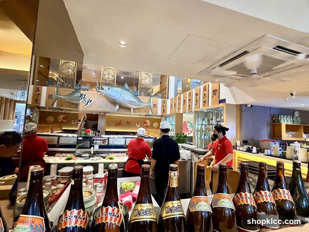 Sushi Restaurant Interior with Staff and Bottles