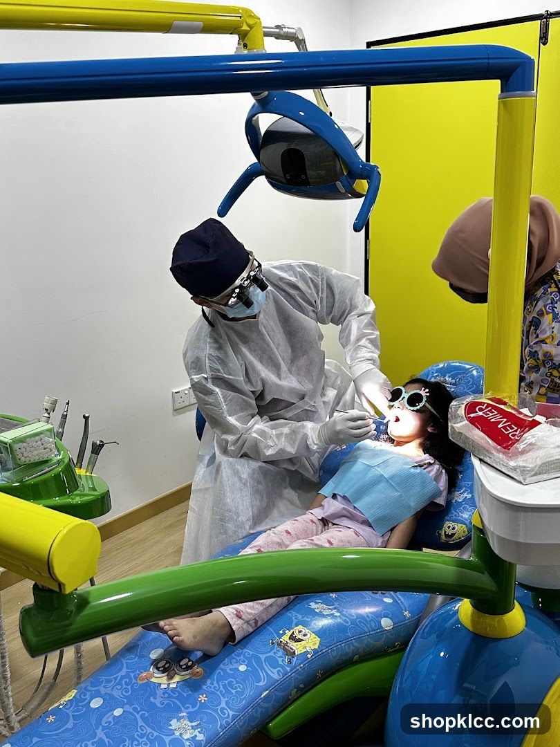 Dentist examining a child's teeth