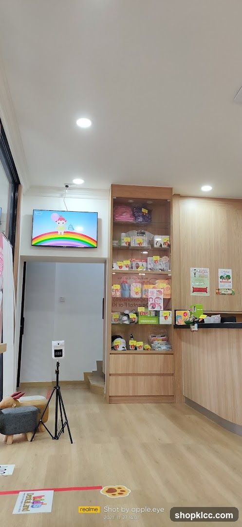 Interior of a store with display shelves and a TV