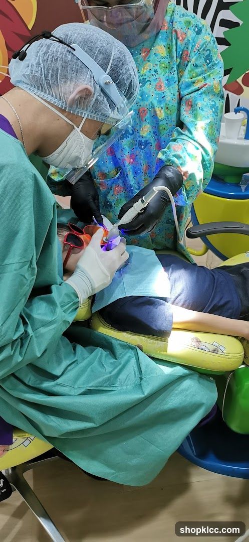 Dentist performing a procedure on a child