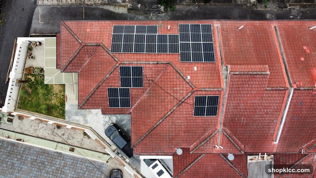 Aerial view of a building with solar panels on the roof
