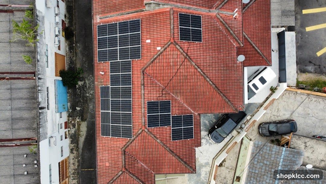 Aerial view of a house with solar panels on the roof