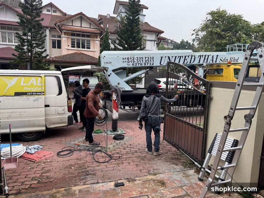 Workmen installing gate system