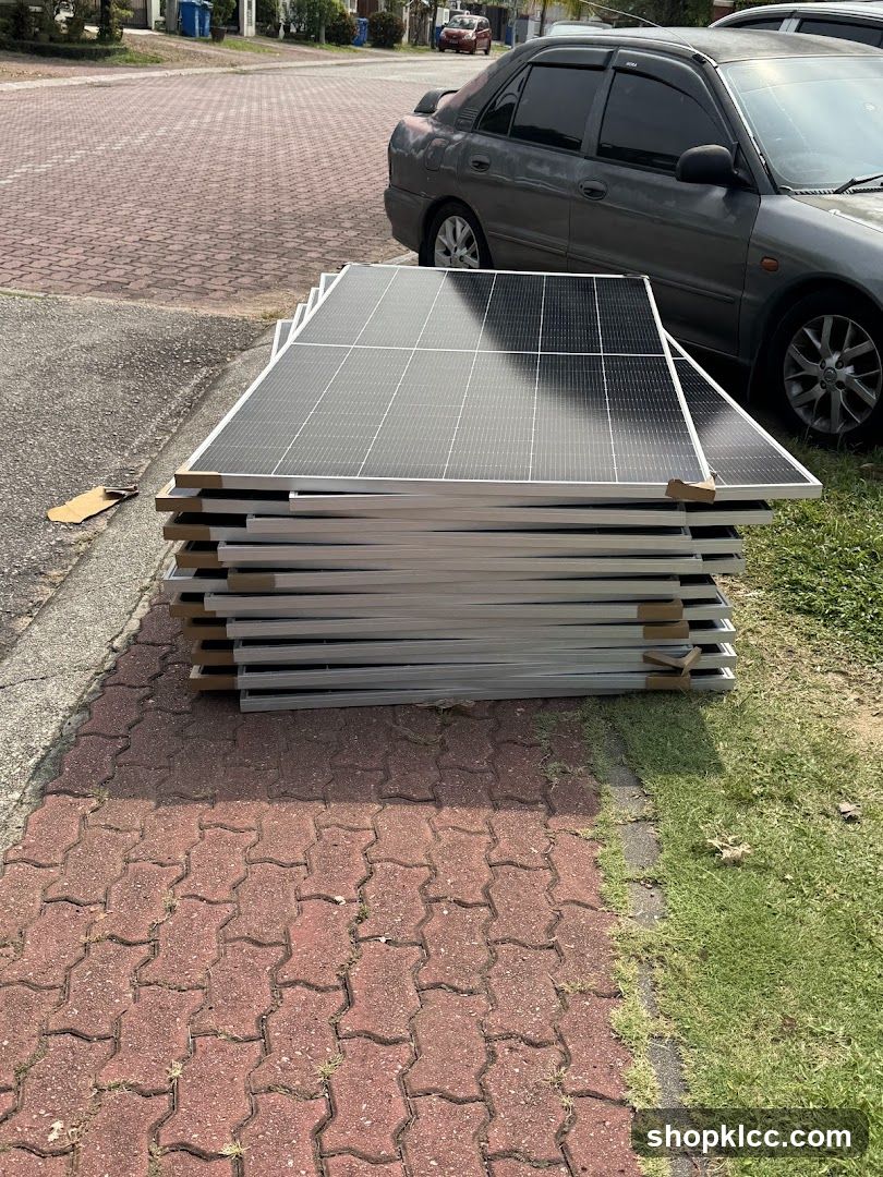 Stack of Solar Panels on Sidewalk