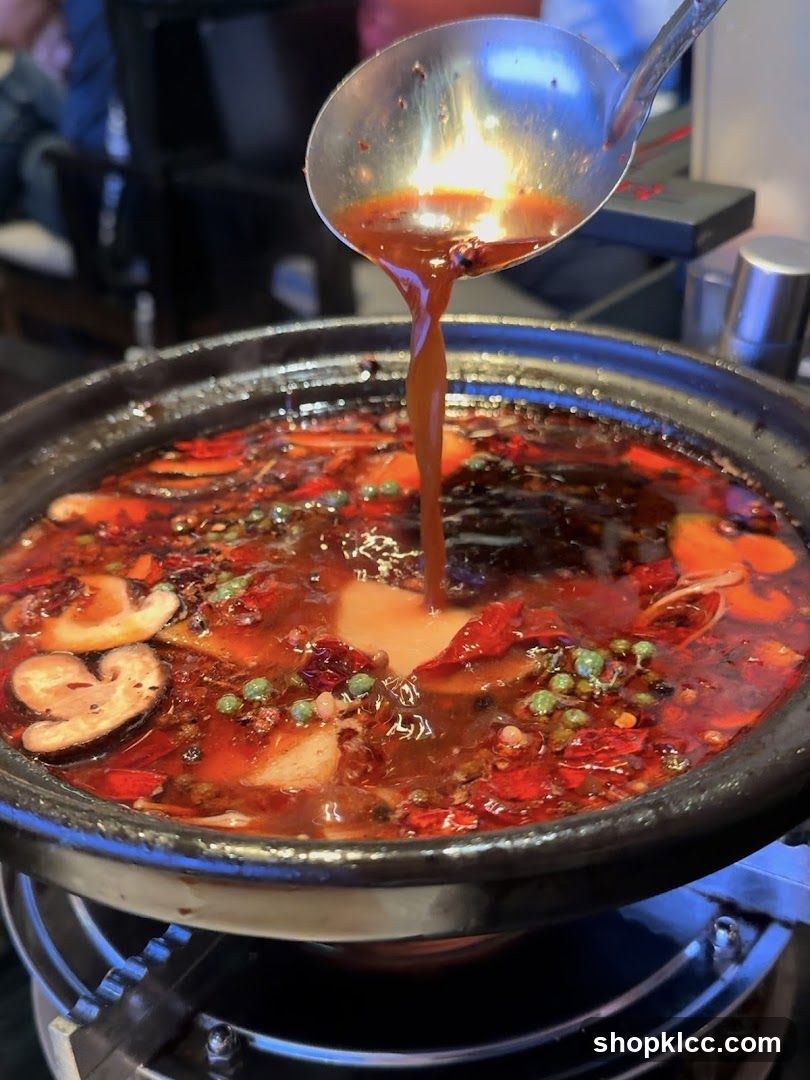 Spicy Hot Pot with Chili Oil Pouring
