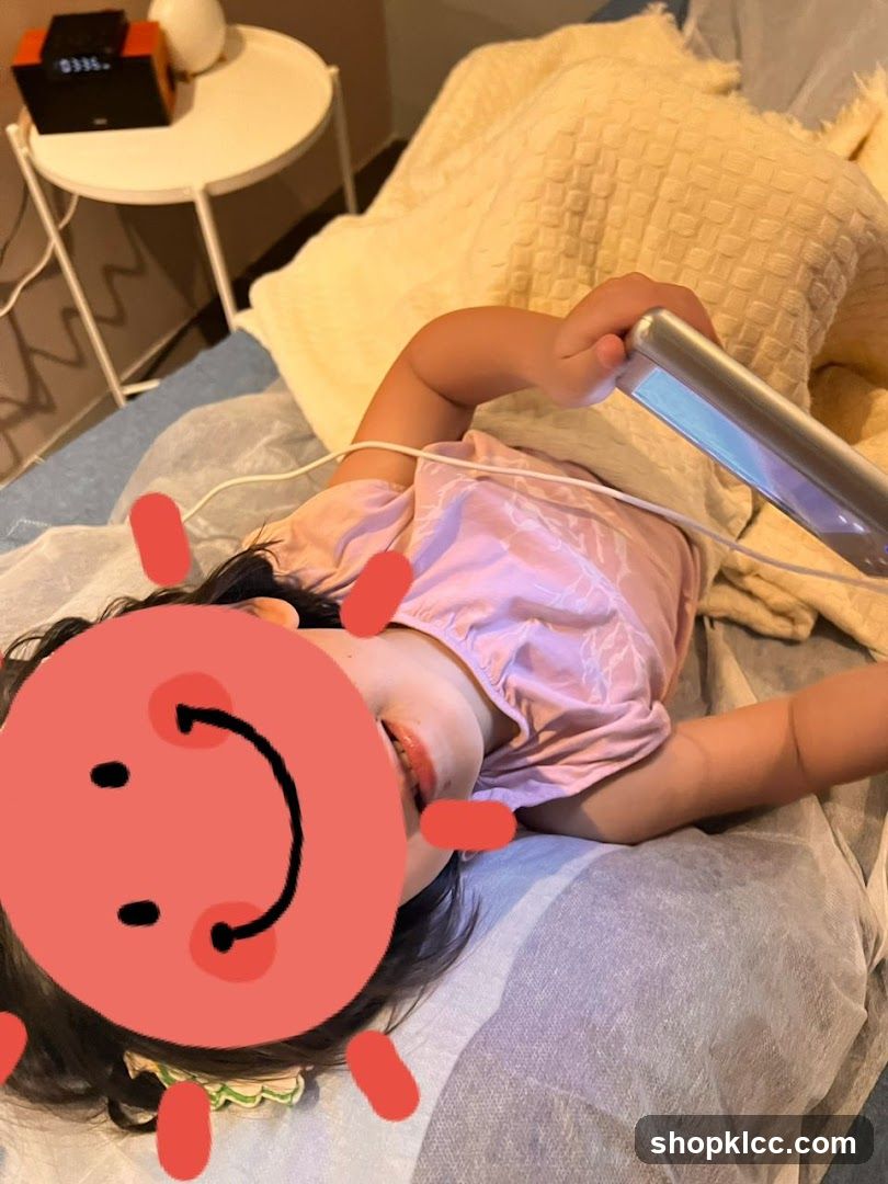 Child with device on bed