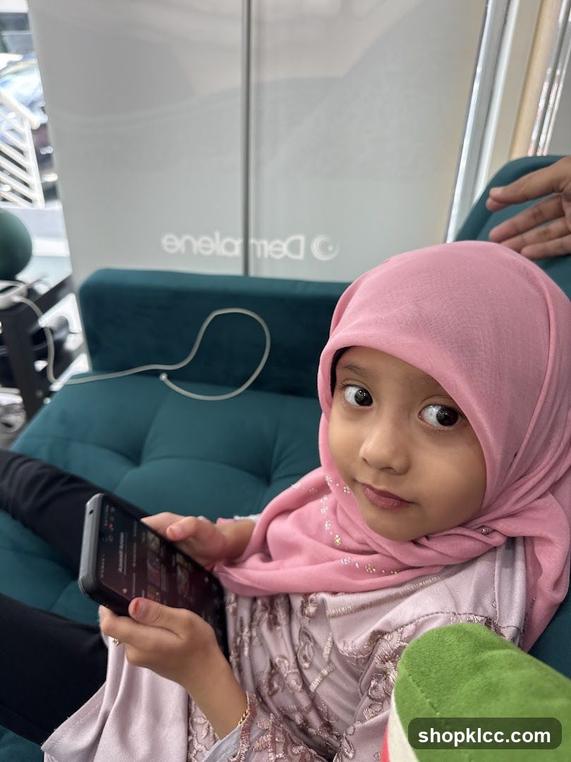 Girl with Pink Hijab Holding Phone